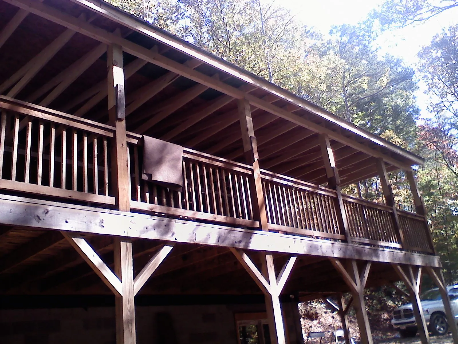 Timber framing under a new elevated porch and deck — Roof Leak Repair in Center Conway by Roofing Brothers